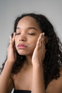 A Girl Applying a Facial Wash